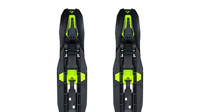 Pair of high-performance cross-country skis with black and neon green design, suitable for winter sports and outdoor adventures.