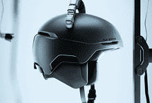 High-tech winter sports helmet with integrated communication system, designed for skiing and snowboarding enthusiasts, featuring a sleek black finish and secure fit.